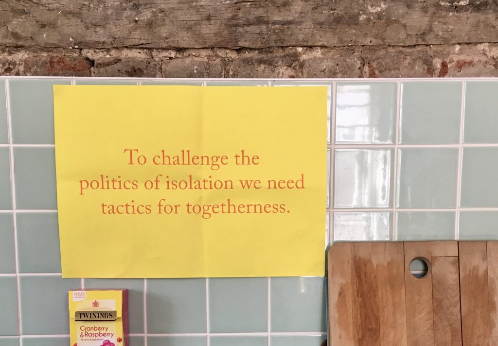 A poster in the kitchen at The White House: "To challenge the politics of isolation we need tactics for togetherness".